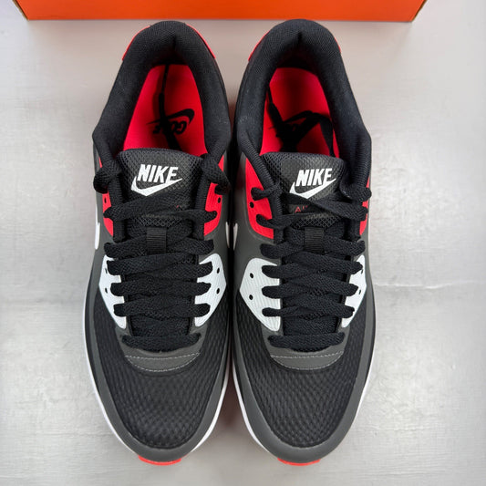Nike trainers black with infrared accents and grey detailing, featuring Air Max cushioning.