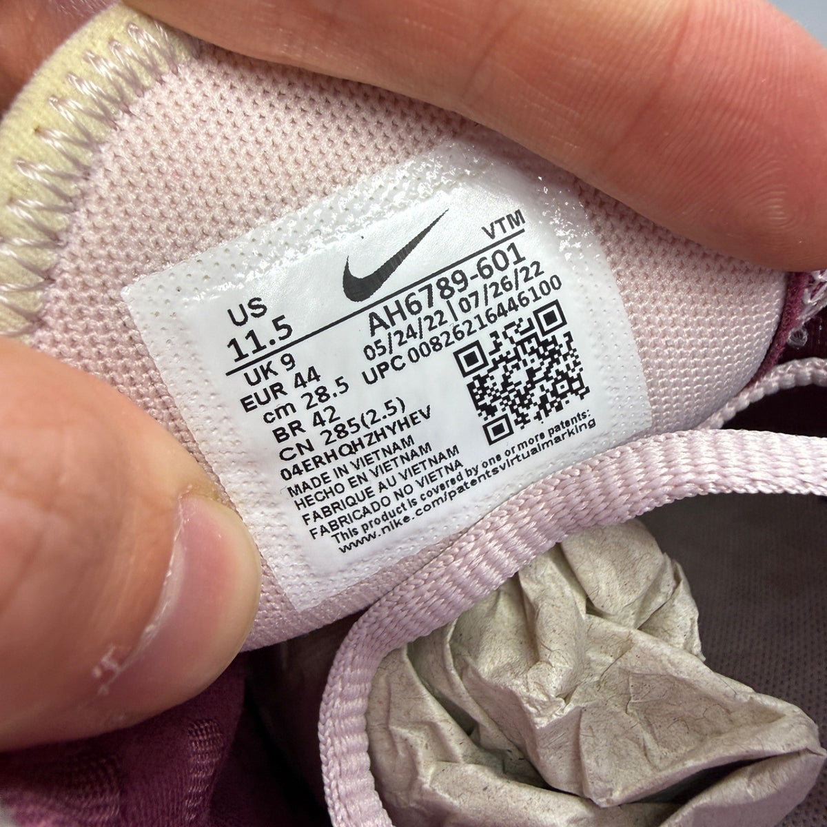 Nike trainers barely rose pink with white accents and Air Max cushioning.