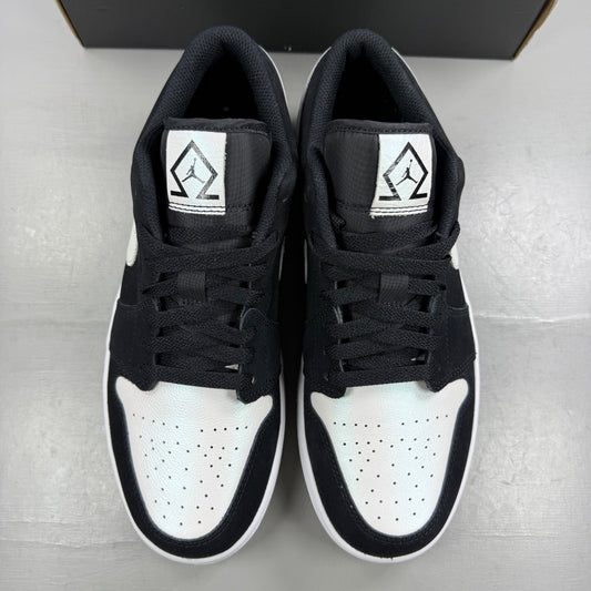 Jordan black athletic shoes with white accents and diamond pattern details.