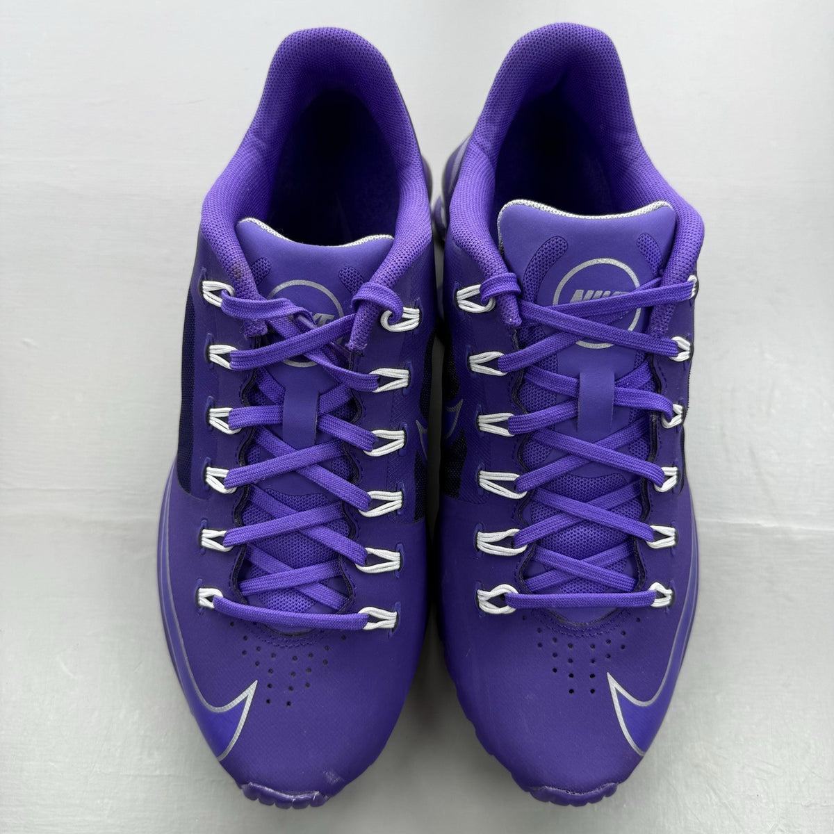 Nike trainers purple with silver accents and distinctive Shox cushioning system.