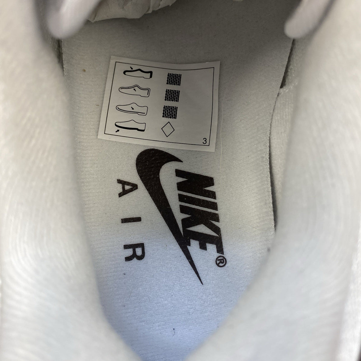 Nike Air Max 1 '87 trainers white with grey accents and brown detailing.