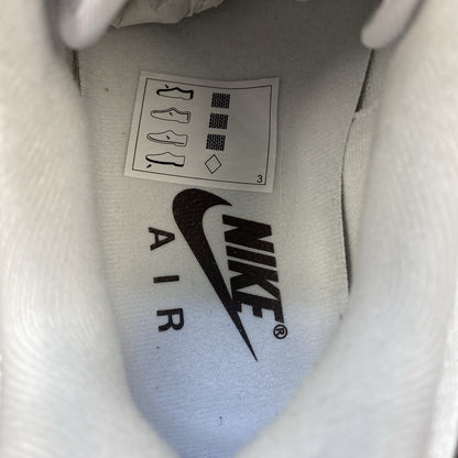 Nike Air Max 1 '87 trainers white with grey accents and brown detailing.