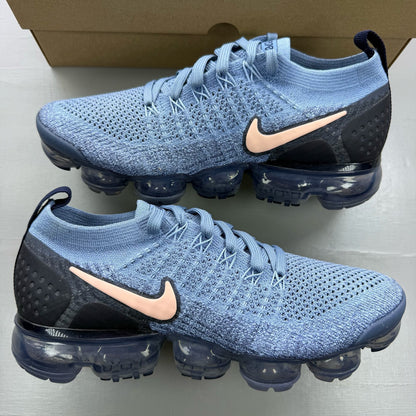 Nike blue trainers with Flyknit upper and Air cushioning technology.