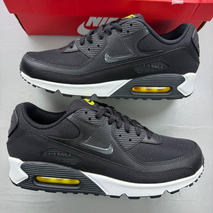 Nike trainers black with jewel accents and Opti Yellow detailing.