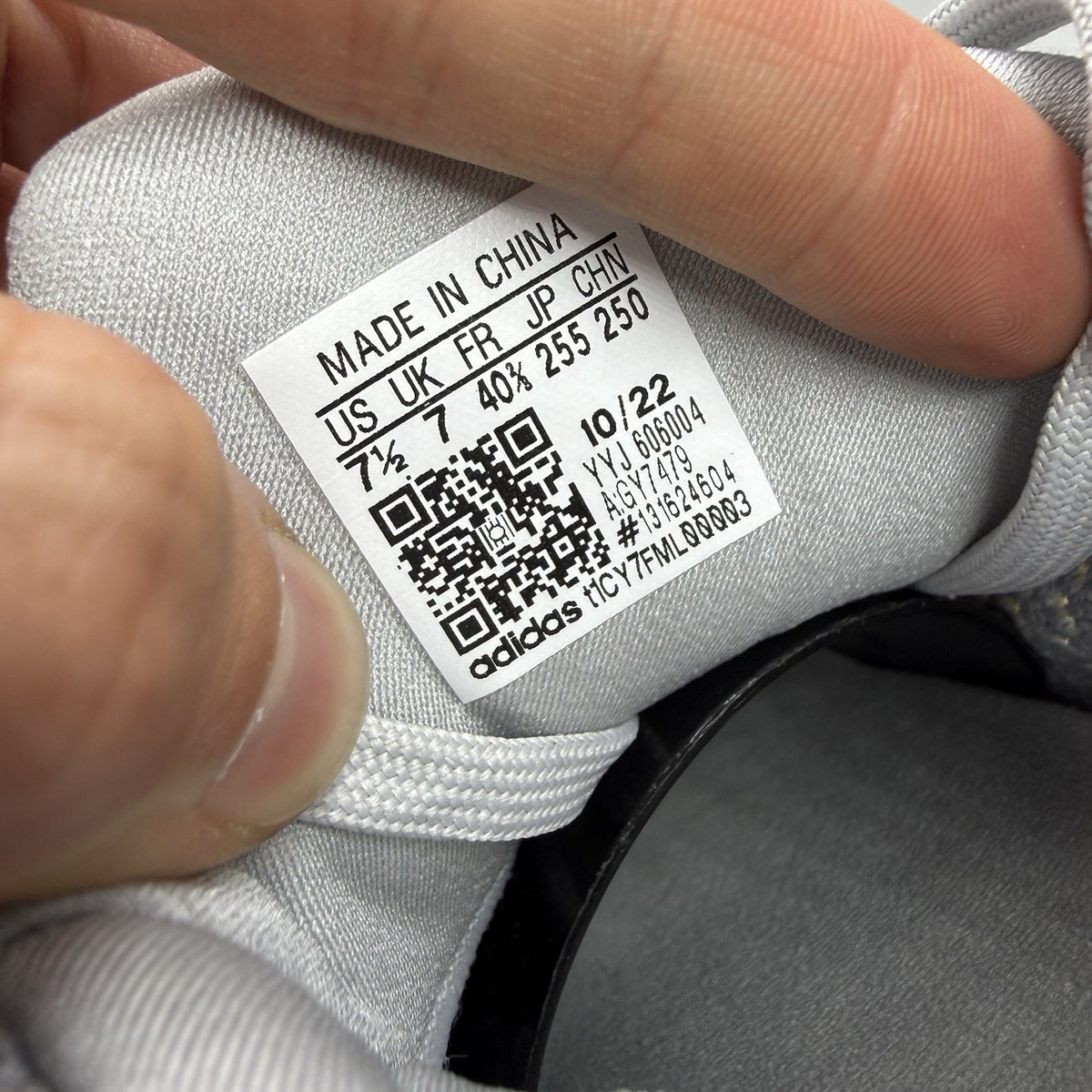 Adidas Ultra Boost 1.0 grey trainers with bold gold accents and white sole.