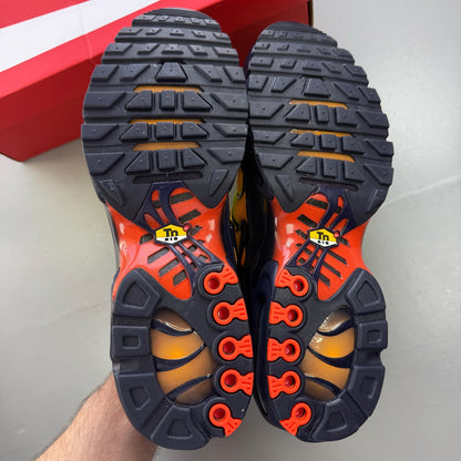 Nike Air Max Plus trainers yellow with Hyper Crimson accents and iconic TN logo.