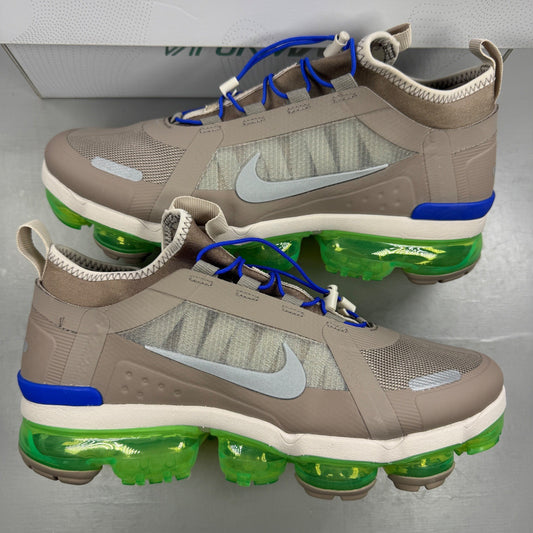 Nike running shoes beige with Air VaporMax sole and utility design.