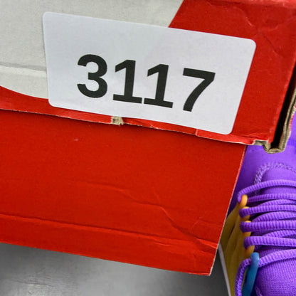 Nike Air Presto purple trainers with mesh upper and distinctive logo detailing.