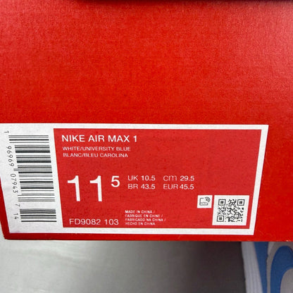 Nike Air Max 1 blue trainers with white accents and UNC logo detailing.