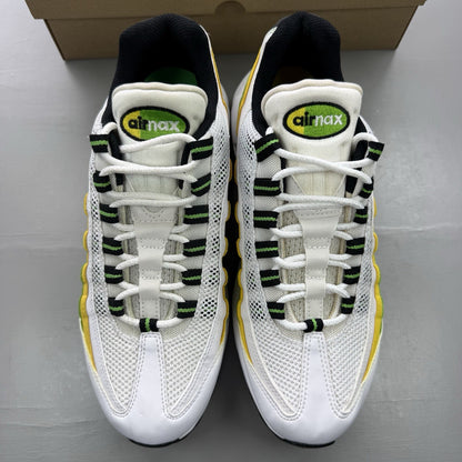 Nike Air Max 95 white trainers with green and yellow accents, featuring iconic logo details.