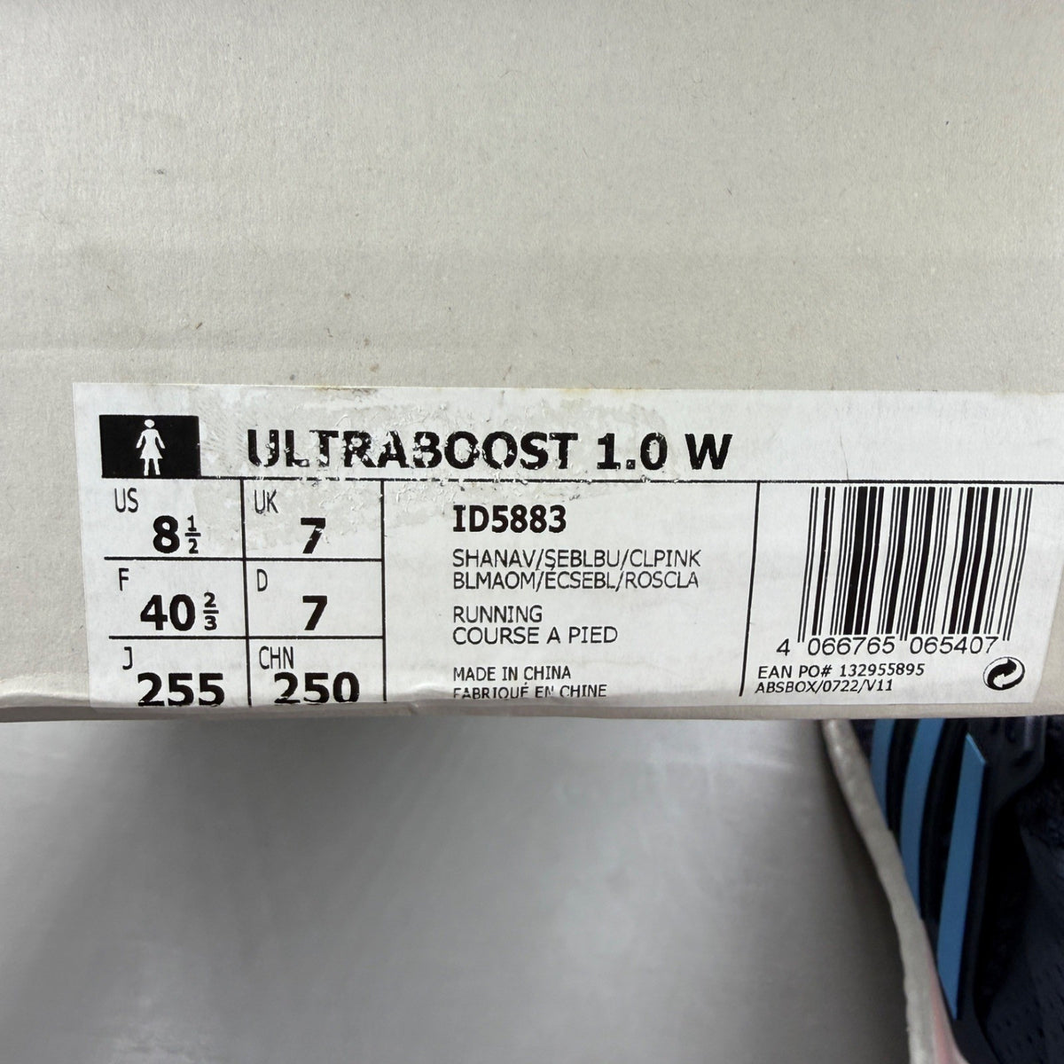 Adidas blue trainers with mesh upper and signature three stripes logo.