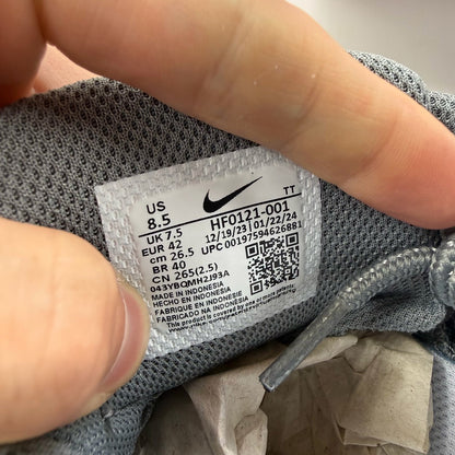Nike Air Max 95 grey trainers with distinctive design and logo details.