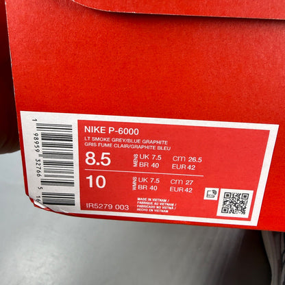 Nike athletic shoes light smoke grey with blue graphite accents and logo details.