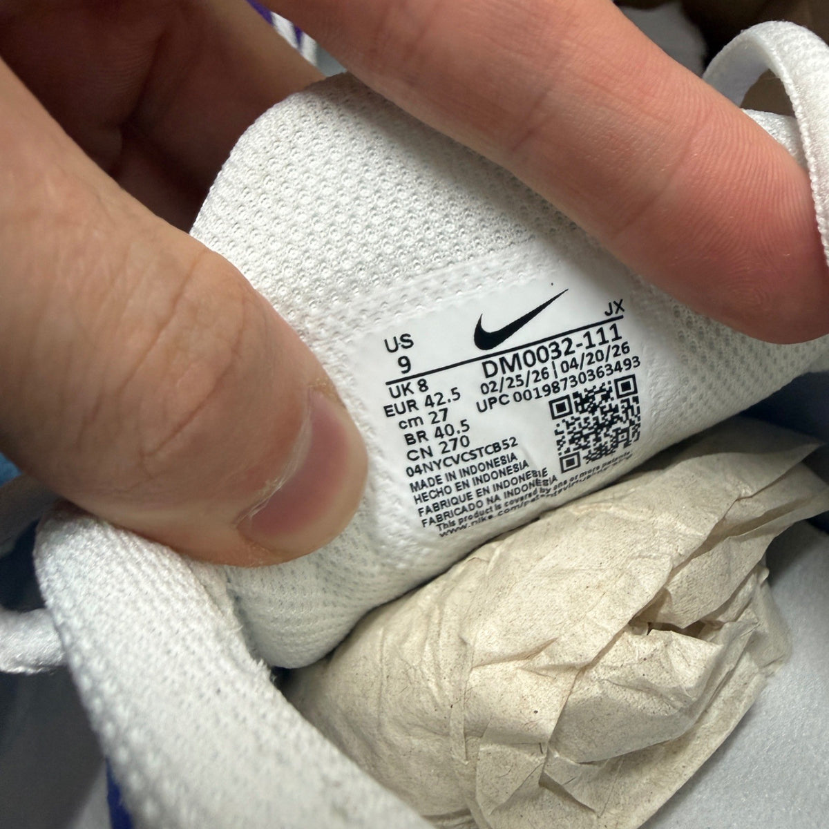 Nike deck shoes white gradient with blue and purple accents, featuring signature logo.