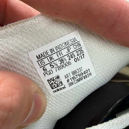 Adidas white LA Trainer with tropical pattern and logo detail on the side.