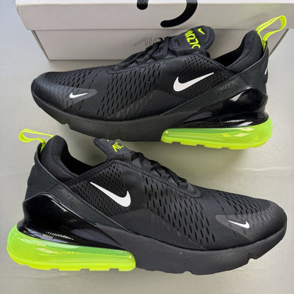 Nike Air Max 270 black trainers with neon volt accents and white sole.