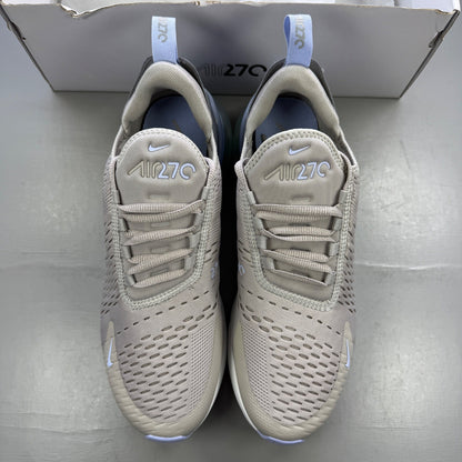 Nike grey trainers with Air Max cushioning and logo detail on the tongue.