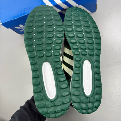 Adidas green trainers with white accents and logo detailing, brand new in box.