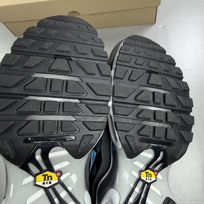 Nike Air Max Plus TN trainers white iridescent finish with signature swoosh logo.