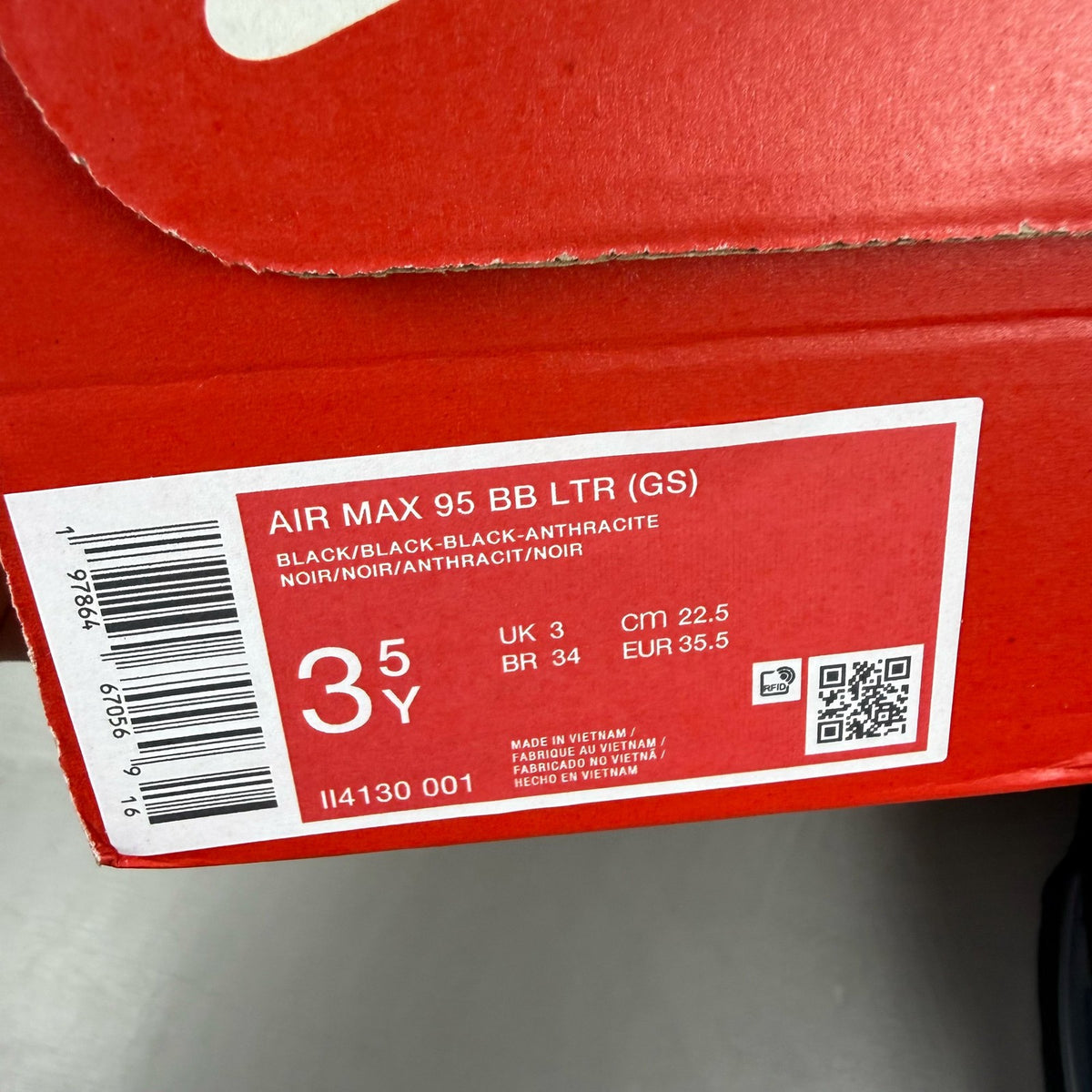 Nike Air Max 95 black trainers with big bubble sole and logo detail.