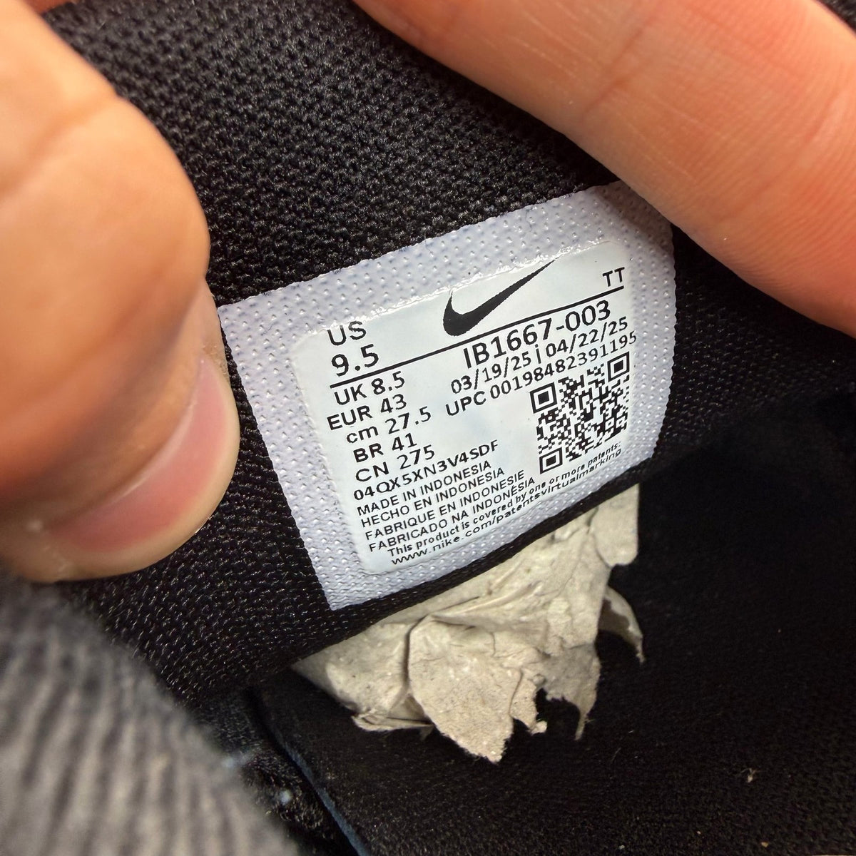 Nike Air Max 95 black sneakers with metallic silver accents and big bubble sole design.