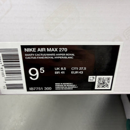Nike Air Max 270 blue trainers with white accents and logo detailing.