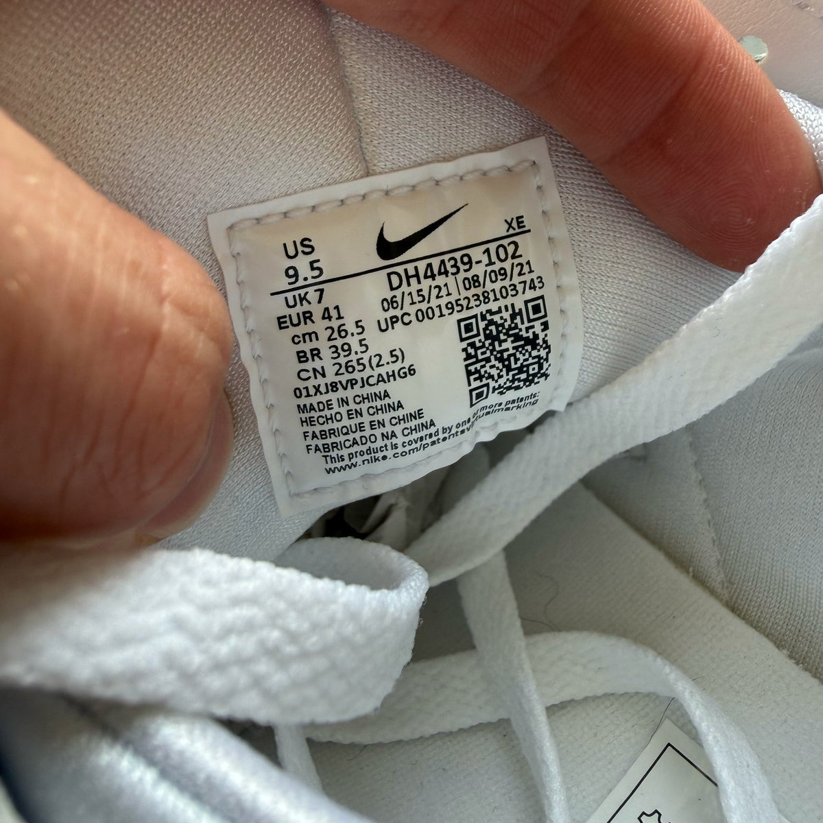Nike Air Huarache white trainers with textured upper and signature logo detail.