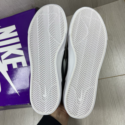 Nike black SB Zoom Stefan Janoski RM sneakers with white logo and sleek design.