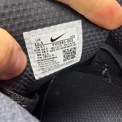Nike grey trainers with reflective swoosh logo and anthracite detailing.