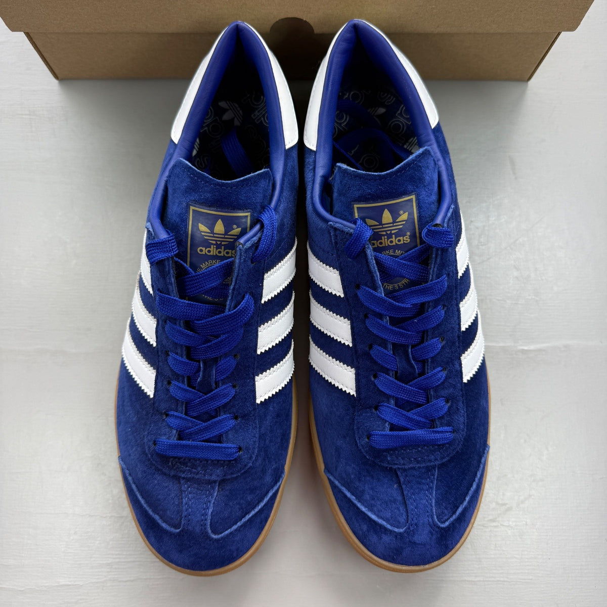 Adidas blue deck shoes suede upper with white logo and gum sole.