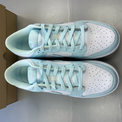 Nike Dunk Low trainers glacier blue and white with signature swoosh logo.