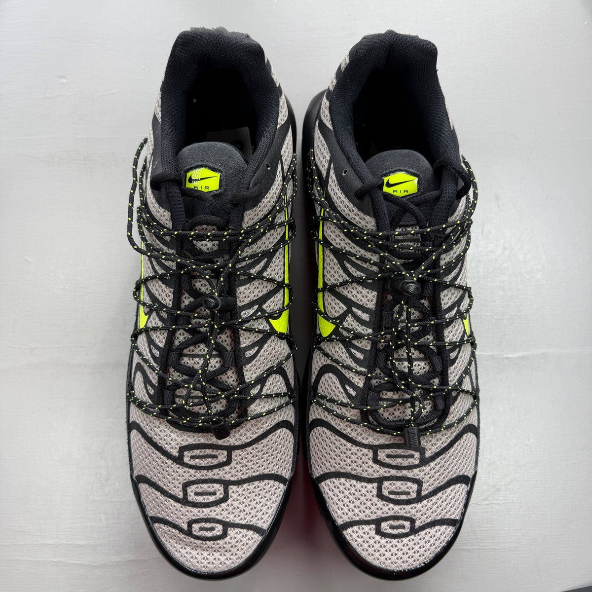 Nike deck shoes black grey with volt accents and signature logo details.