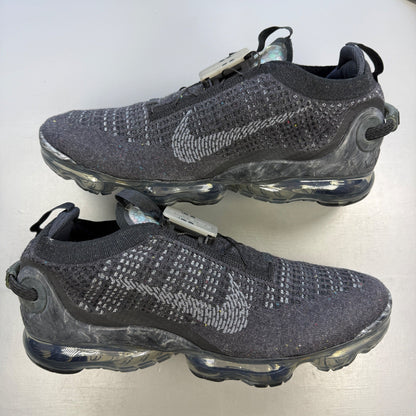 Nike black trainers Flyknit upper with grey accents and Air Max cushioning.