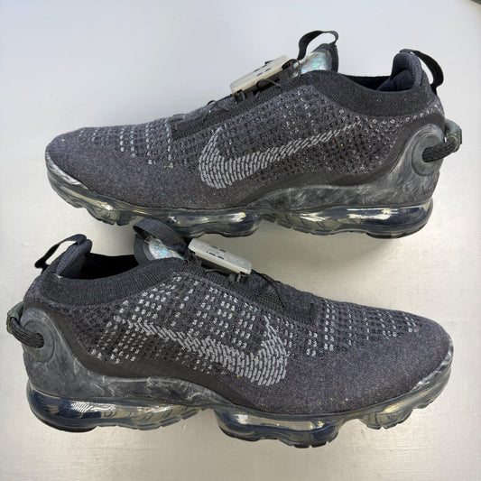 Nike black trainers Flyknit upper with grey accents and Air Max cushioning.