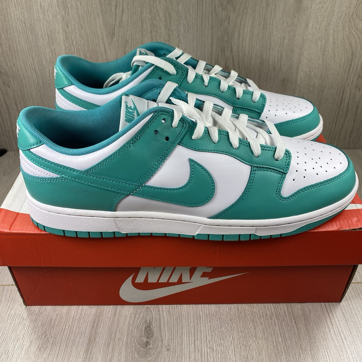 Nike Dunk Low trainers white with clear jade accents and signature swoosh logo.