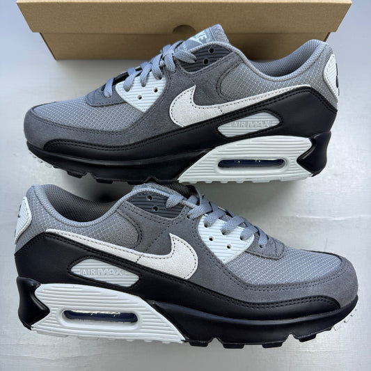 Nike trainers grey with black accents and logo, featuring a sleek design and breathable material.