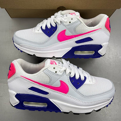 Nike Air Max 90 white trainers with purple and pink accents, featuring logo details.