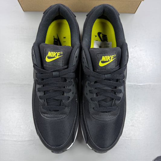 Nike trainers black with yellow accents and jewel detailing, featuring iconic swoosh logo.
