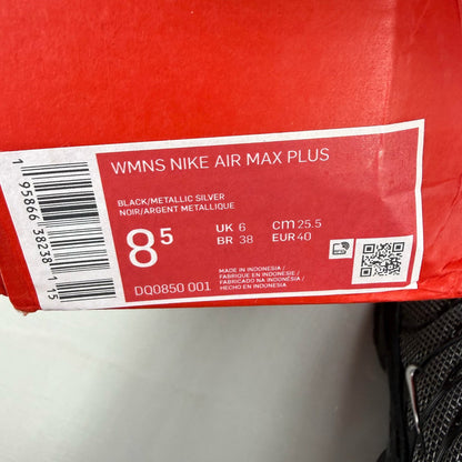 Nike black trainers suede material with silver accents and iconic Air Max Plus design.