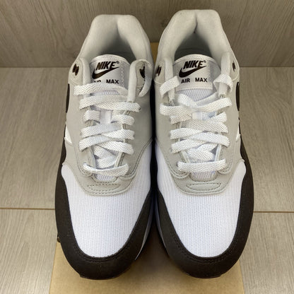 Nike Air Max 1 '87 trainers white with grey accents and brown detailing.