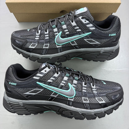 Nike black trainers with grey and turquoise accents, featuring a sleek mesh upper.