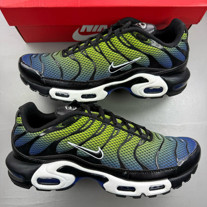 Nike Air Max Plus TN green trainers with black and volt accents, featuring signature logo.