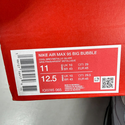 Nike running shoes grey with big bubble sole and reflective detailing.
