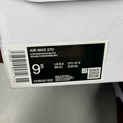 Nike trainers red with black and white accents, featuring Air Max cushioning and logo.