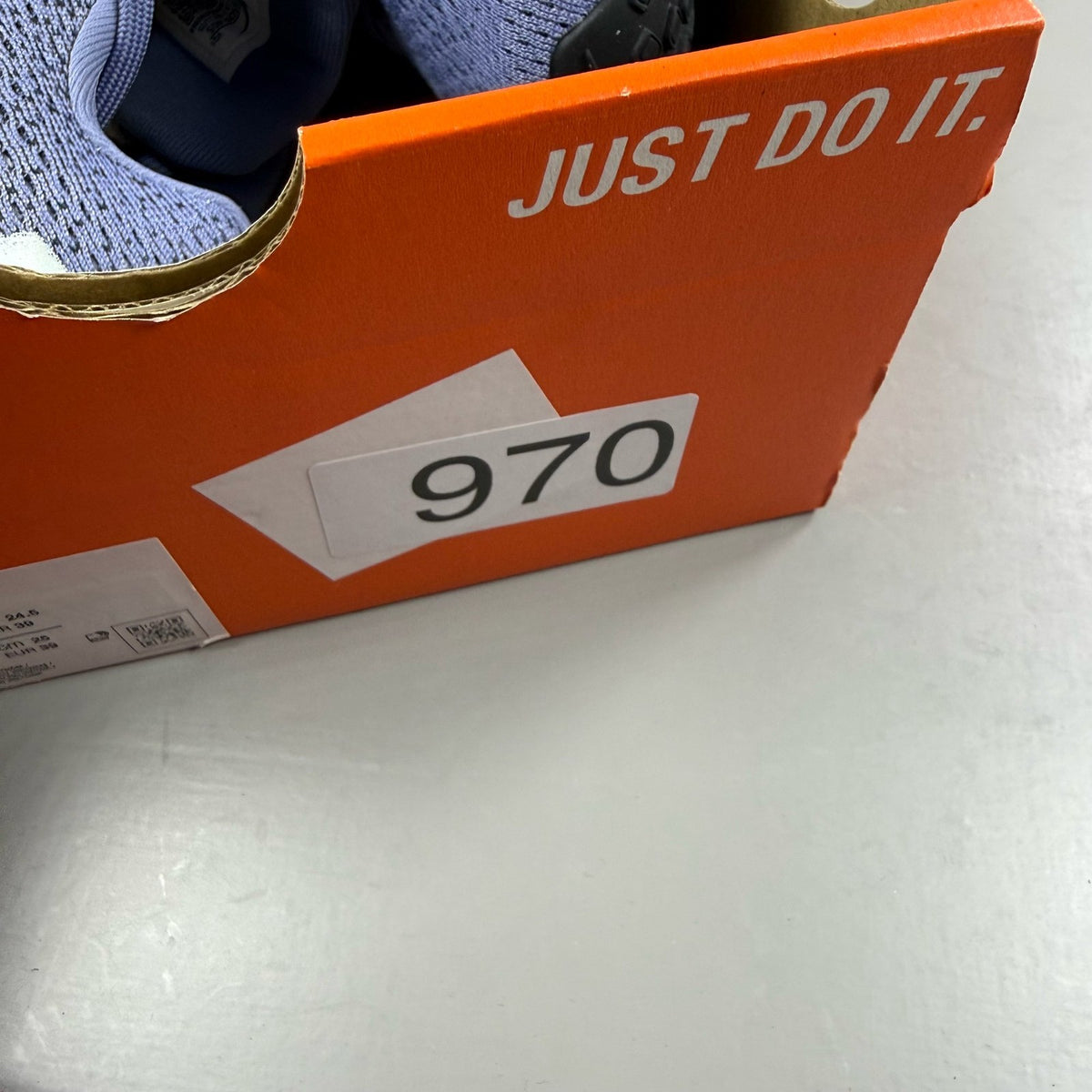 Nike blue trainers with mesh upper and swoosh logo, size UK 6.