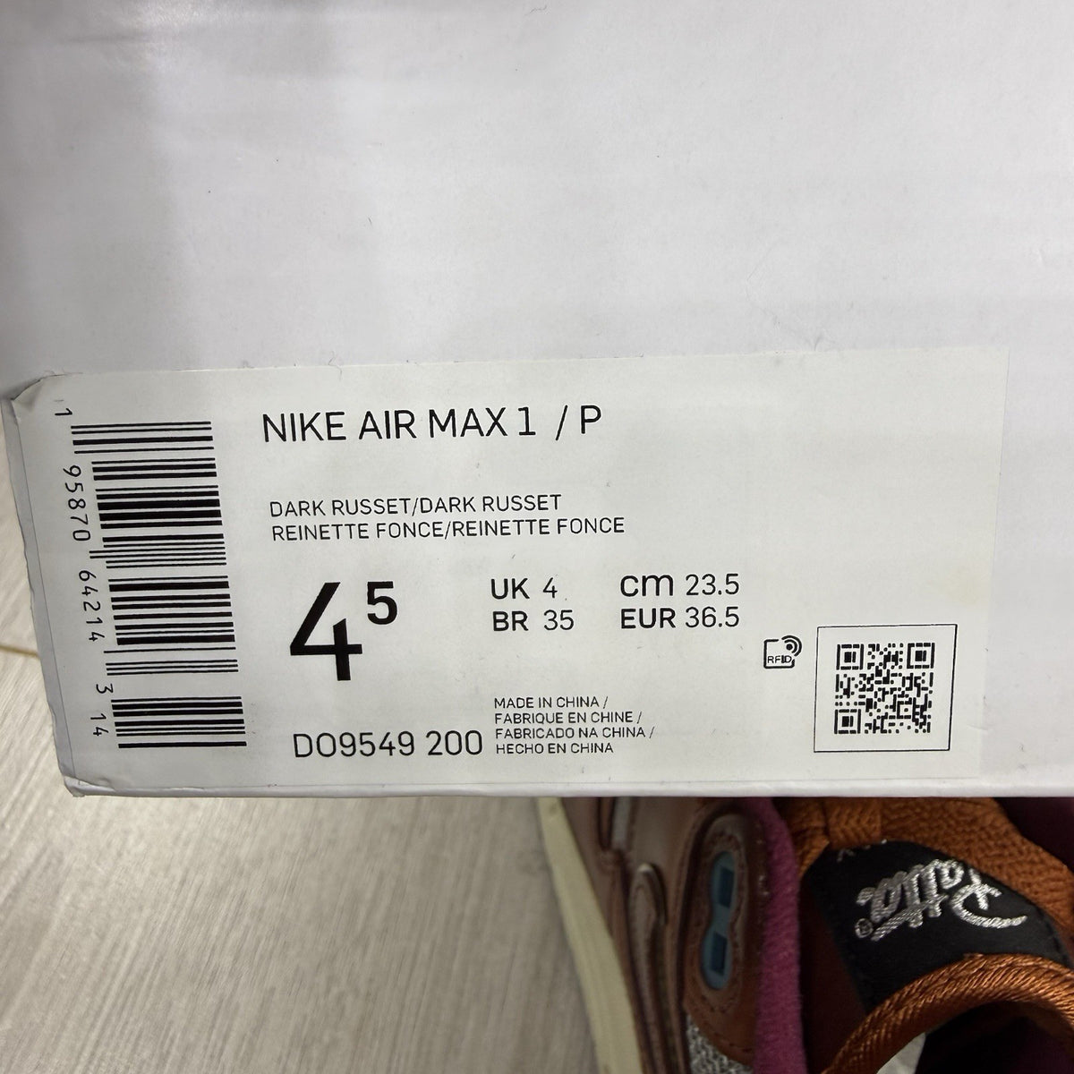 Nike Air Max 1 brown trainers with unique Patta logo and premium suede material.