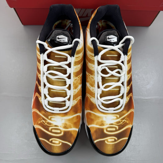 Nike Air Max Plus TN red trainers with signature logo and vibrant orange accents.