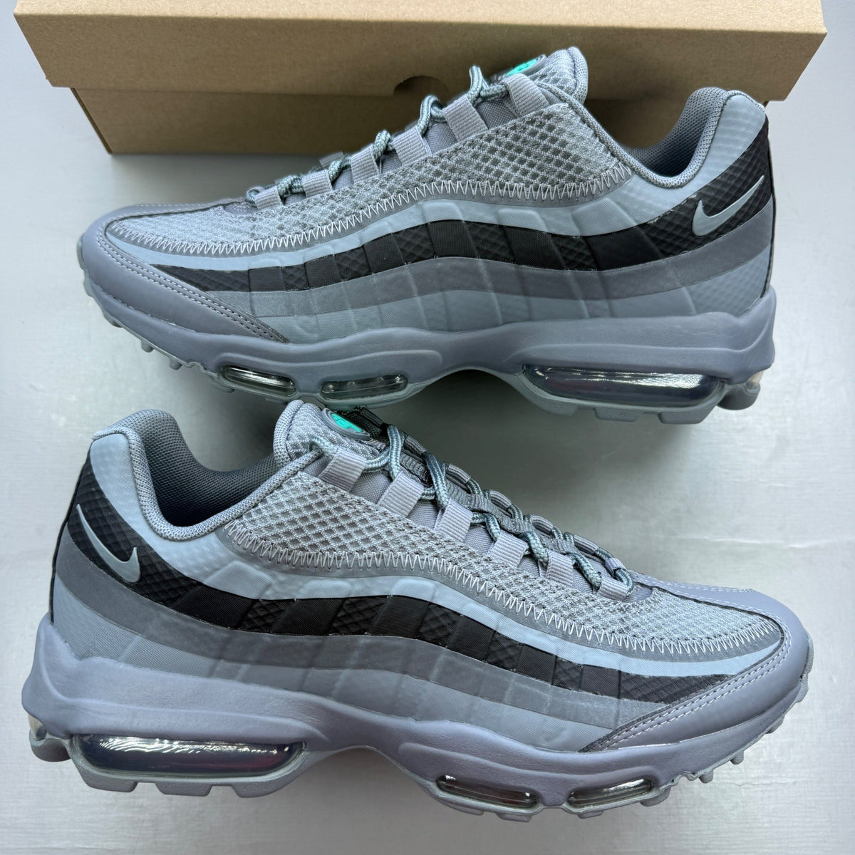 Nike running shoes grey with black accents and signature logo on the side.
