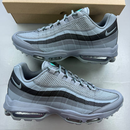 Nike running shoes grey with black accents and signature logo on the side.