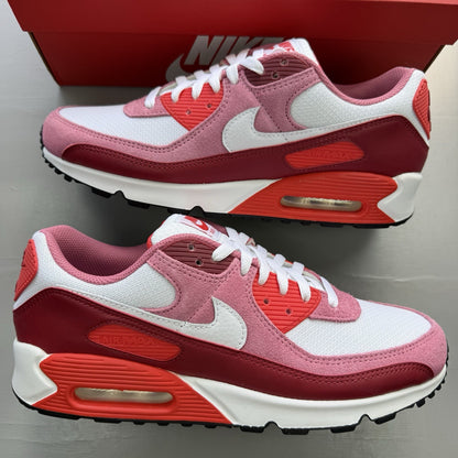 Nike Air Max 90 trainers white with peony and light crimson accents, classic logo.
